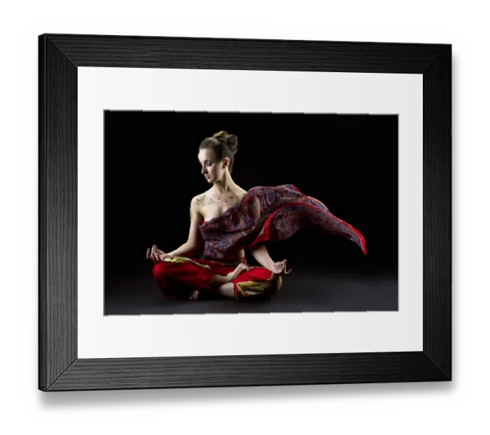 Framed Print : Beautiful calm woman meditates in lotus position and her sari flying