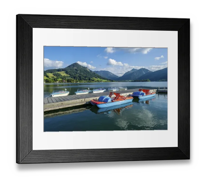 Framed Print : Electric boats and pedal boats at jetty