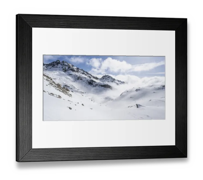 Framed Print : Atmospheric clouds in a wintry mountain landscape Framed Print : Atmospheric clouds in a wintry mountain landscape