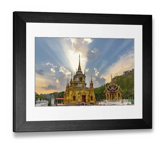 Framed Print : Sunbeams over the Buddhist temple Wat Namtok Mae Klang in Ban Luang