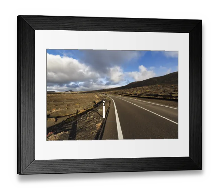 Framed Print : Empty country road through wine-growing area