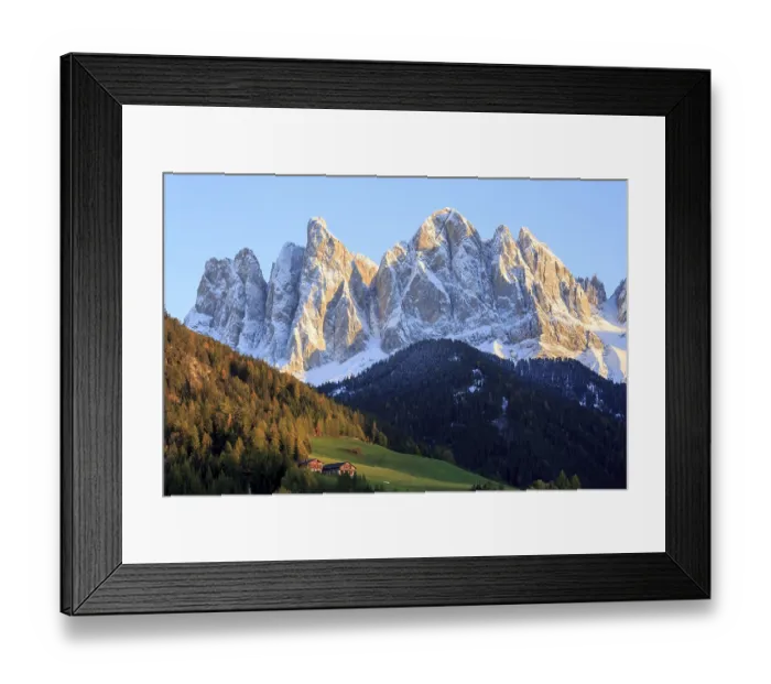 Framed Print : Rocky mountain peaks in the warm light of the setting sun