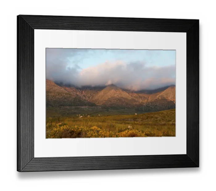 Framed Print : Mountain landscape at dusk with clouds enveloping the peaks in a tranquil rural setting