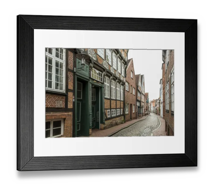 Framed Print : Half-timbered houses and alley in the old town