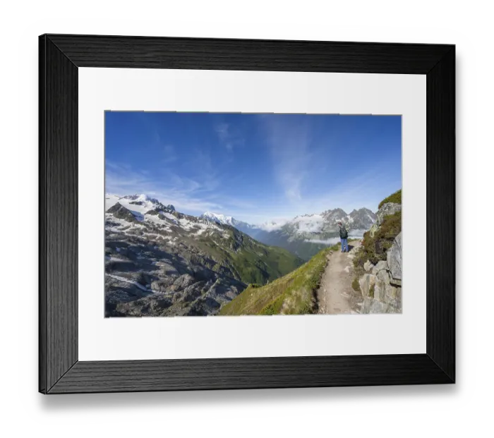 Framed Print : Mountaineer on a hiking trail, view into the valley with summit Mont Blanc