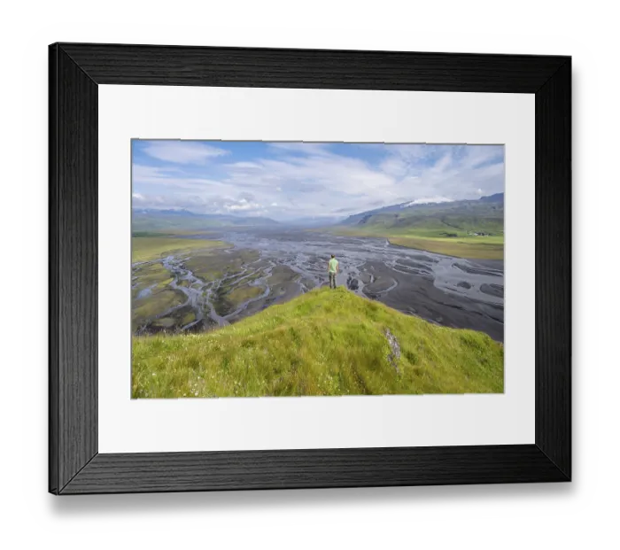 Framed Print : Hiker, young man on a hill, view over alluvial land