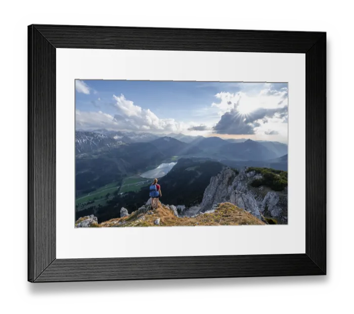 Framed Print : Evening atmosphere, mountaineer at the summit of Schartschrofen looking down on Haldensee
