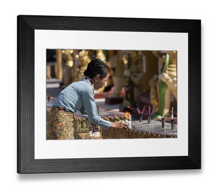 Framed Print : Local woman lighting candles, sacrificial offerings Framed Print : Local woman lighting candles, sacrificial offerings