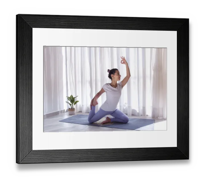Framed Print : Woman practices yoga with her hand in gyan mudra position on purpure yoga mat