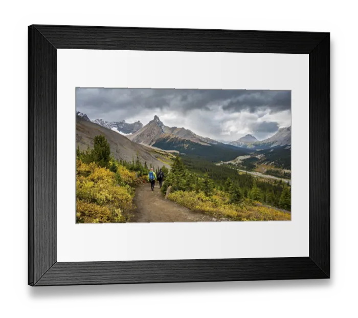 Framed Print : Two hikers between autumnal bushes