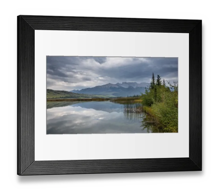 Framed Print : Hilly, mountainous landscape, trees reflected in a lake Framed Print : Hilly, mountainous landscape, trees reflected in a lake
