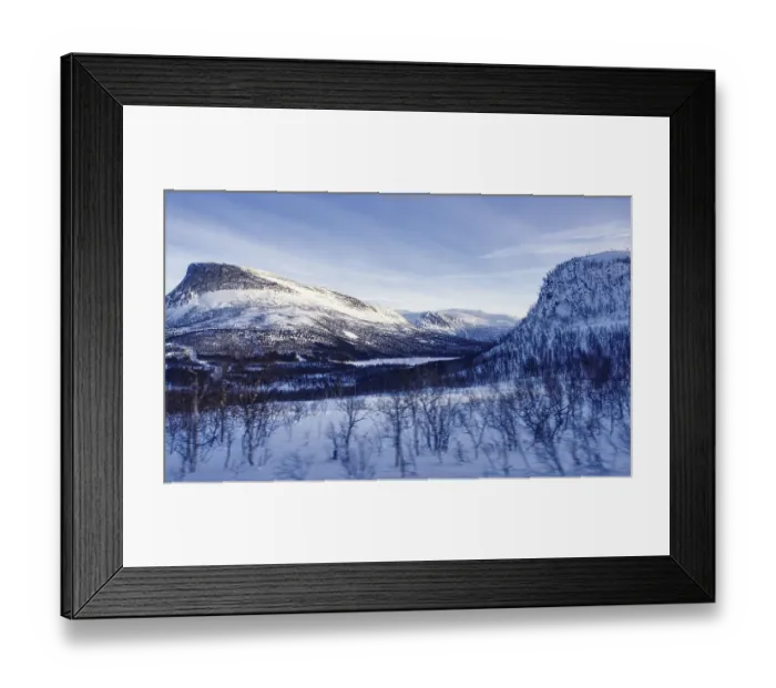 Framed Print : Vast snow-covered mountain landscape under a blue sky