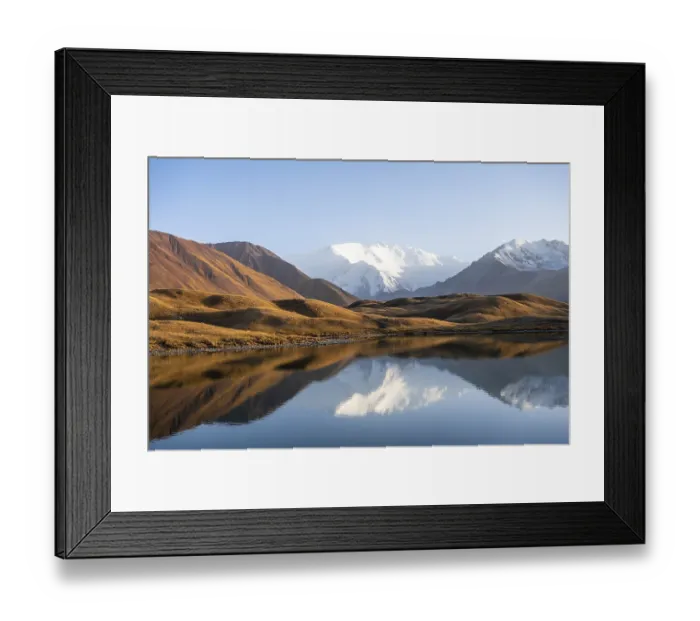 Framed Print : White glaciated and snowy mountain peak Pik Lenin at sunset
