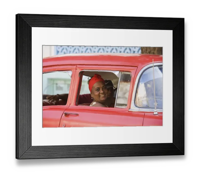Framed Print : Woman looking out of a car window