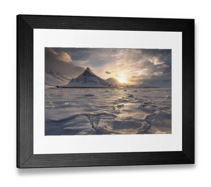 Framed Print : Frozen fjord at sunset, behind mountain Volandstinden Framed Print : Frozen fjord at sunset, behind mountain Volandstinden