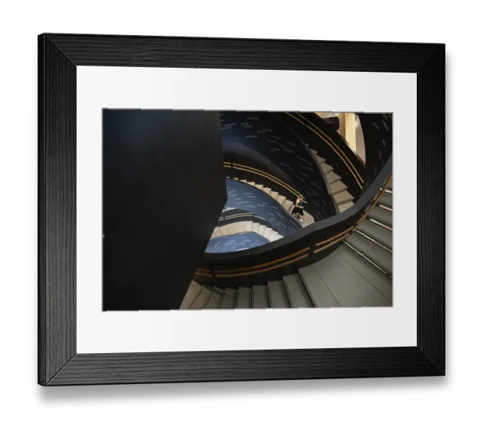 Framed Print : Woman on spiral staircase printed with Finnish words Framed Print : Woman on spiral staircase printed with Finnish words