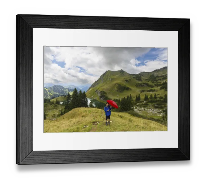Framed Print : Woman 60-65 hiking with umbrella