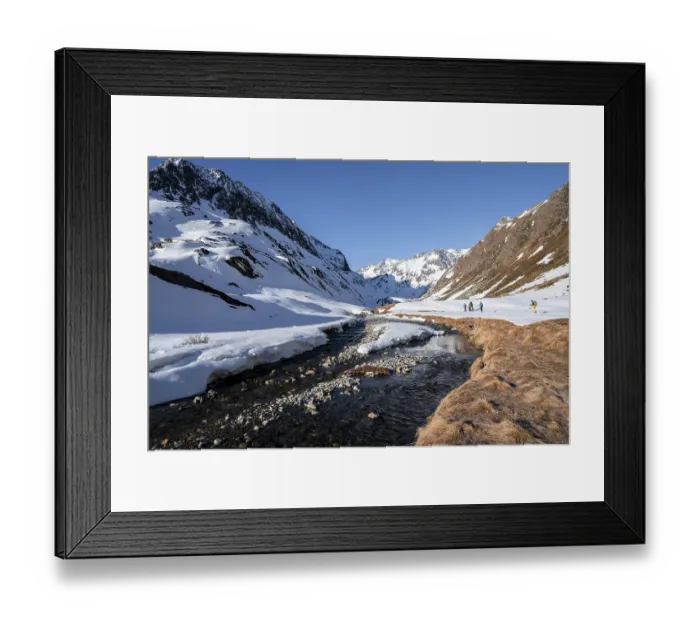 Framed Print : Oberbergbach in winter with snow-covered mountain landscape