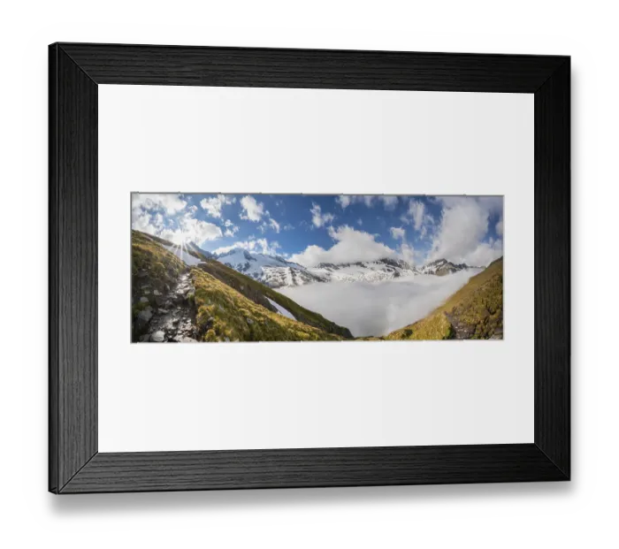 Framed Print : Hiking trail in front of snow-covered mountain peaks Framed Print : Hiking trail in front of snow-covered mountain peaks
