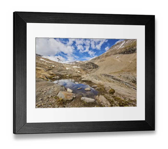Framed Print : Puddle next to Wasserfallwinkelkeesee in the mountains (Grossglockner) in summer on a sunny day Framed Print : Puddle next to Wasserfallwinkelkeesee in the mountains (Grossglockner) in summer on a sunny day