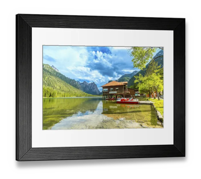 Framed Print : Stunning view of lake dobbiaco with pedal boats and a restaurant