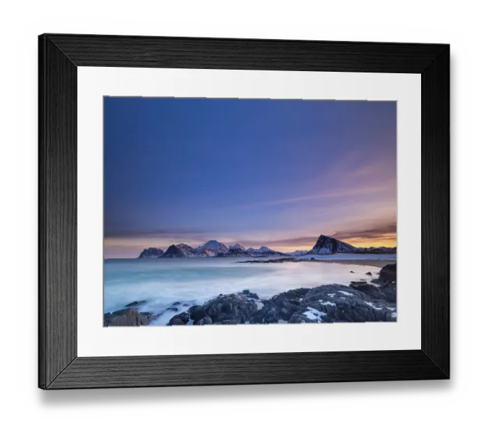 Framed Print : Snow-capped mountains by the sea