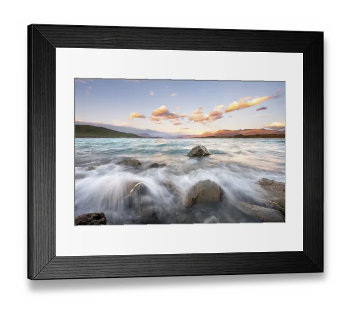 Framed Print : Stones on shore, lake with sunset swell