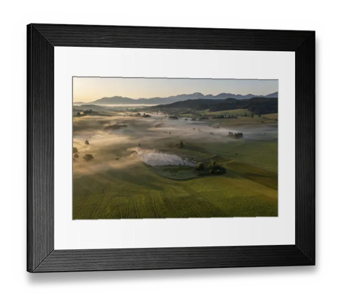 Framed Print : Aerial view of a lake in front of mountains in summer