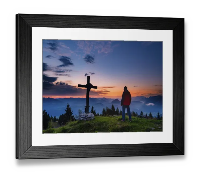 Framed Print : Mountaineer standing next to the summit cross of the Ahornbuechsenkopf at dawn Framed Print : Mountaineer standing next to the summit cross of the Ahornbuechsenkopf at dawn