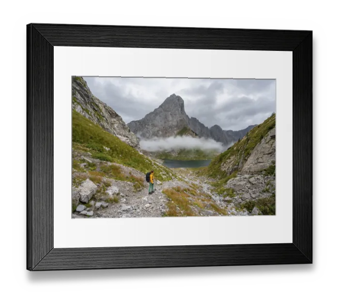 Framed Print : Mountaineer on a hiking trail with a view of rocky Framed Print : Mountaineer on a hiking trail with a view of rocky