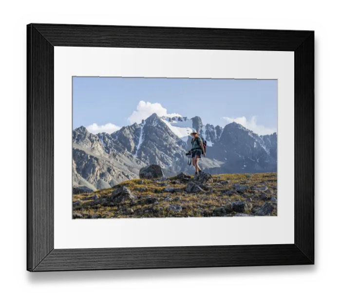 Framed Print : Hiker in a mountain valley in the Tien Shan Mountains Framed Print : Hiker in a mountain valley in the Tien Shan Mountains