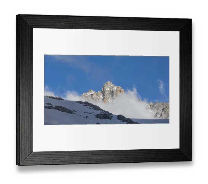 Framed Print : Clouds and rocky mountain peaks