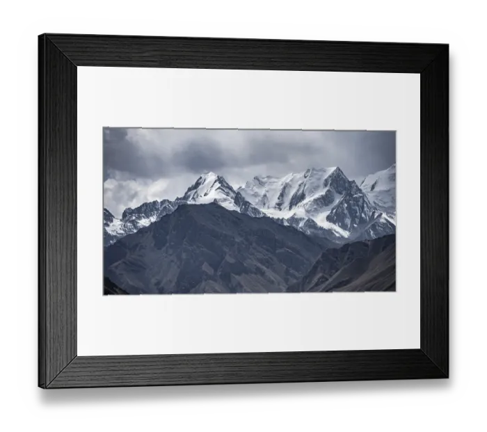 Framed Print : Glaciated and snow-covered mountain peaks