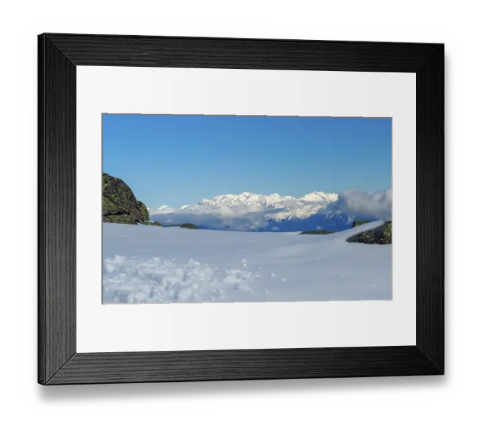 Framed Print : Vast snowy landscape with views of white mountain peaks in South Tyrol and blue skies
