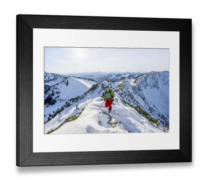 Framed Print : Mountaineer on the ridge of the Aiplspitz in the snow