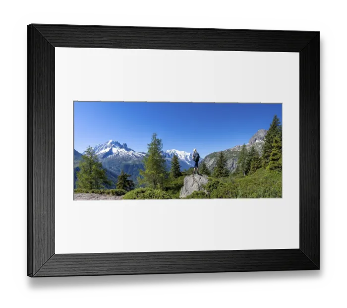 Framed Print : Mountaineer standing on rocks, mountain panorama with glaciated mountain peaks Framed Print : Mountaineer standing on rocks, mountain panorama with glaciated mountain peaks