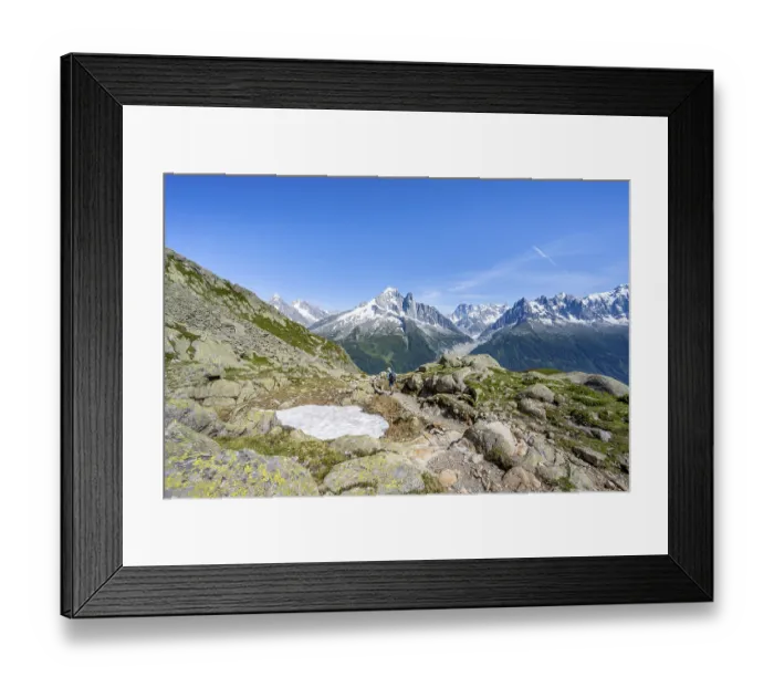 Framed Print : Mountaineer on a hiking trail in front of a mountain landscape Framed Print : Mountaineer on a hiking trail in front of a mountain landscape