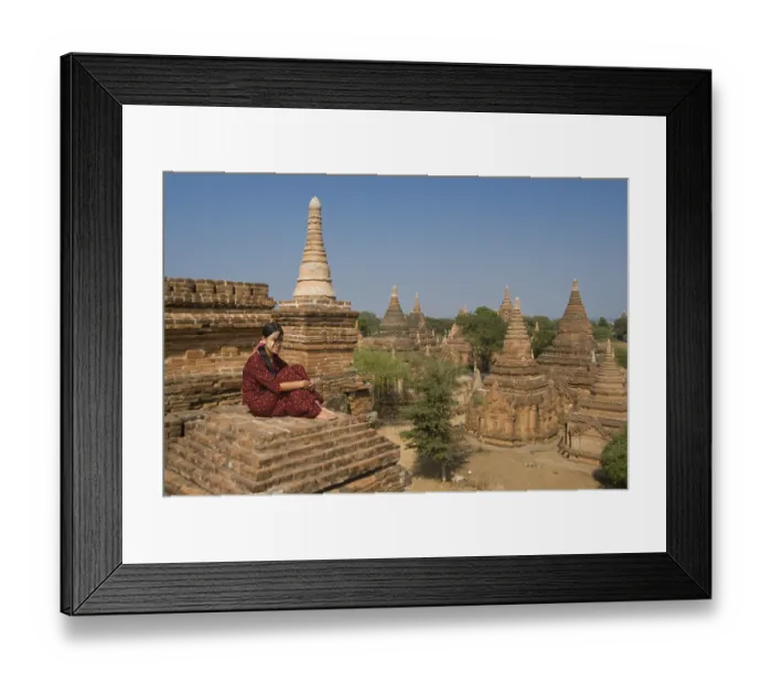 Framed Print : Young Burmese woman on the roof of a temple