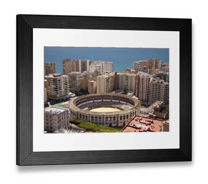 Framed Print : View from Monte de Gibralfaro over a bullring surrounded by skyscrapers