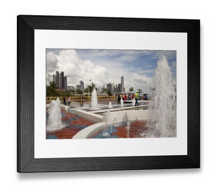 Framed Print : Fountains on the refurbished seafront promenade of Cinta Costera and the skyline of Panama City