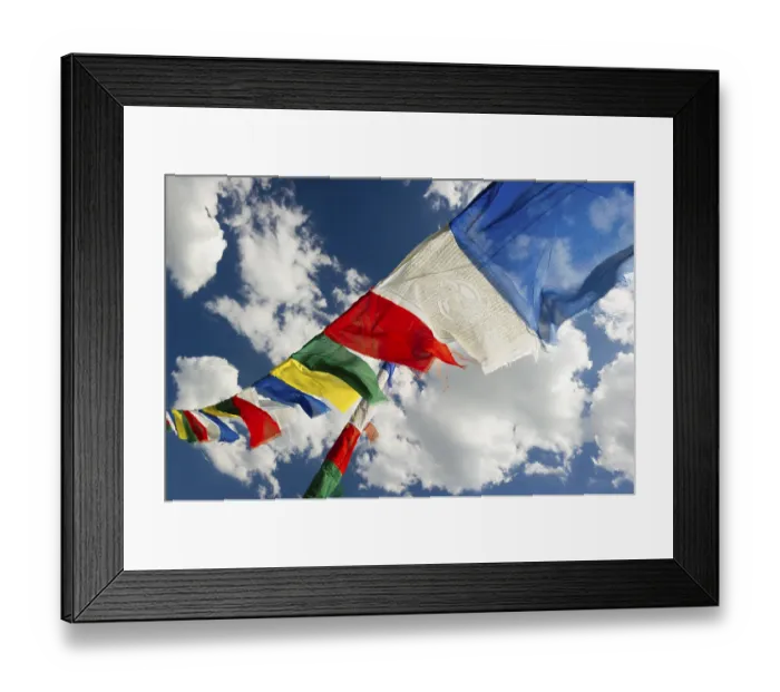 Framed Print : Tibetan prayer flags against a blue sky with clouds Framed Print : Tibetan prayer flags against a blue sky with clouds