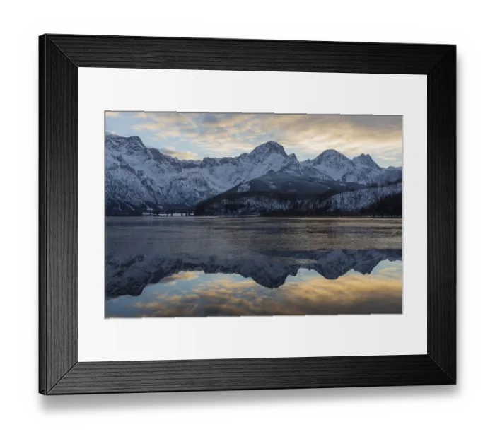 Framed Print : Lake Almsee in winter. Snow on the mountains and some clouds in the sky