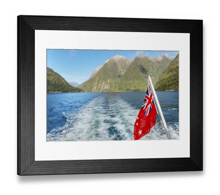 Framed Print : New Zealand flag waving, Milford Sound