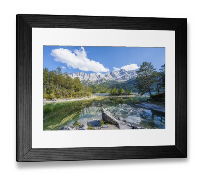 Framed Print : Zugspitze massif and Zugspitze reflected in Eibsee lake