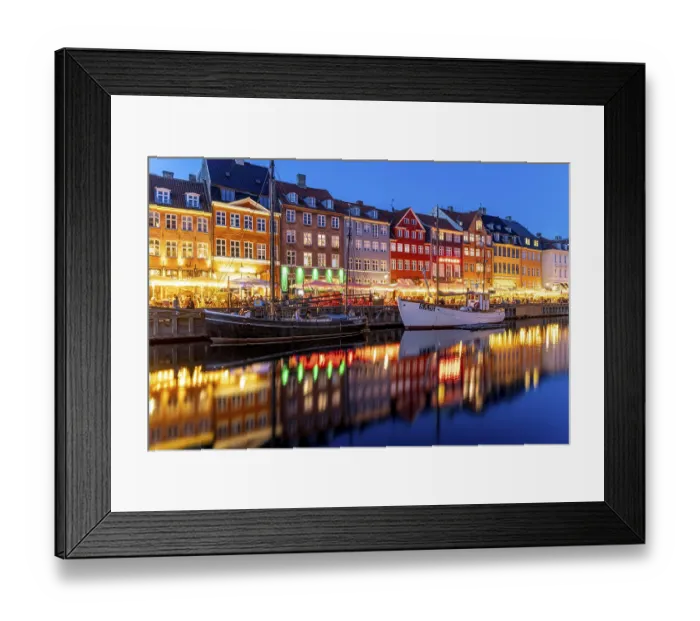 Framed Print : Colourful houses, restaurants and historic ships on the Nyhavn canal and harbour at dusk