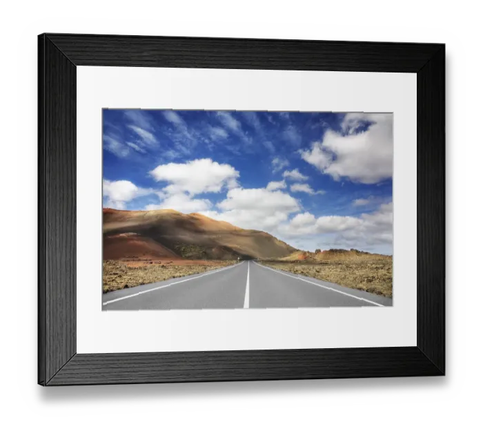 Framed Print : Road through the volcanic landscape in the Timanfaya National Park Framed Print : Road through the volcanic landscape in the Timanfaya National Park