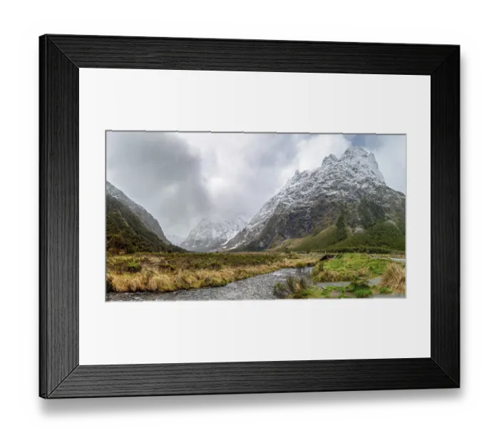 Framed Print : Valley with snow-capped mountains