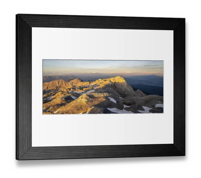 Framed Print : View of rocky plateau with remnants of snow in the evening light