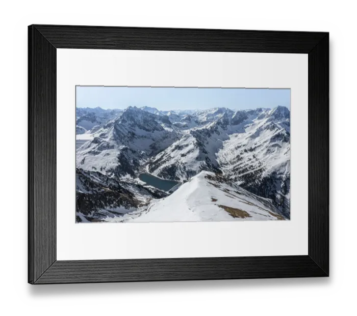 Framed Print : Reservoir, peaks and mountains in winter