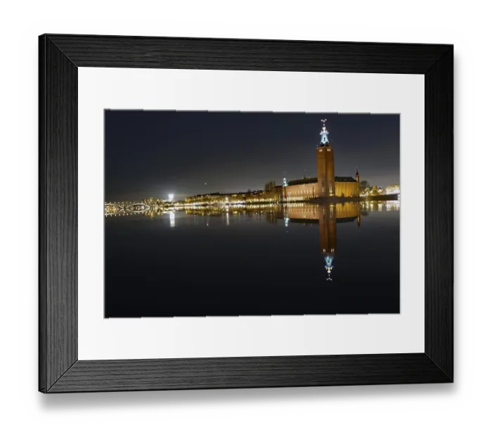 Framed Print : Illuminated building by a calm body of water at night with reflecting water and dark sky Framed Print : Illuminated building by a calm body of water at night with reflecting water and dark sky
